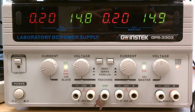 Triple-output DC power supply with dual variable output (CH1 & CH2) and fixed 5V output (CH3).